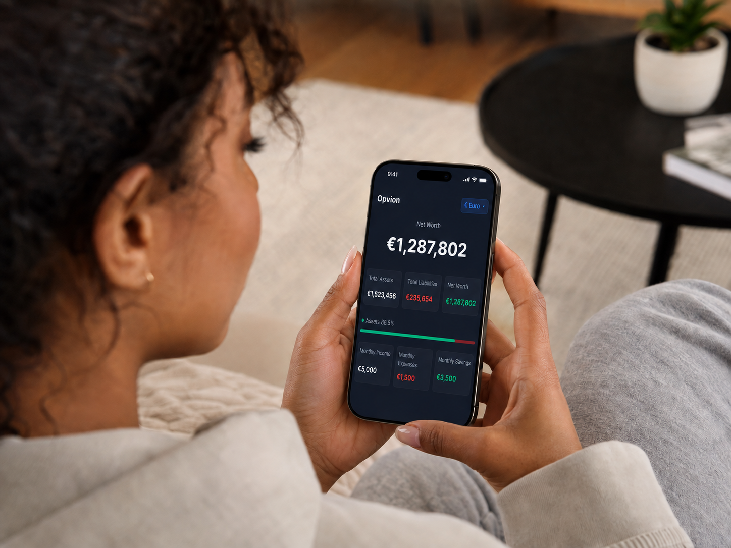 Opvion net worth dashboard shown on a phone